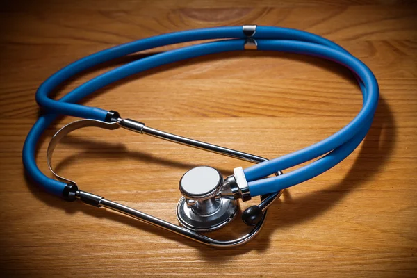 Stethoscope on wooden board — Stock Photo, Image