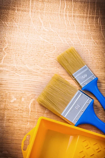 Two paintbrushes with blue handles — Stock Photo, Image