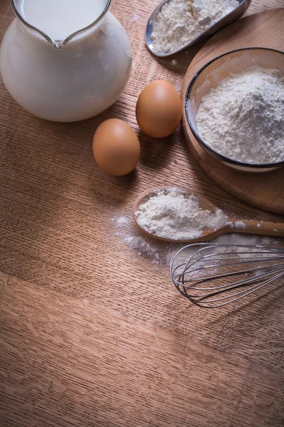 Composition corolla eggs flour in bowl — Stock Photo, Image