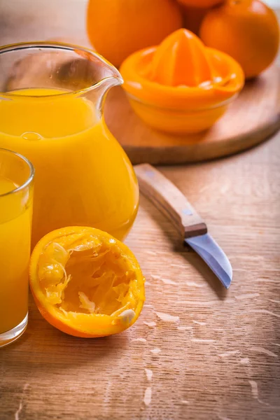 Juice in glass pitcher knife — Stock Photo, Image