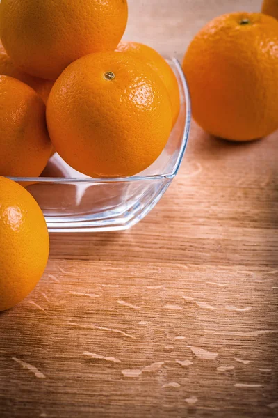 Orange fruits in glass square bowl — Stock Photo, Image