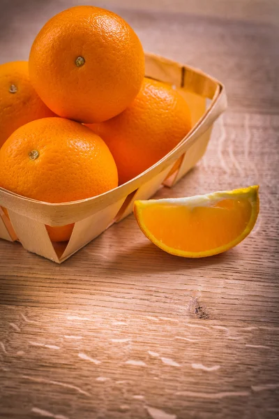 Oranges in wicker basket — Stock Photo, Image