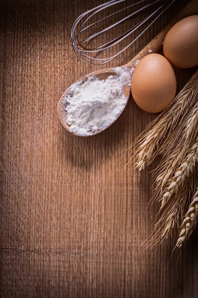 Corolla spoon with flour eggs — Stock Photo, Image