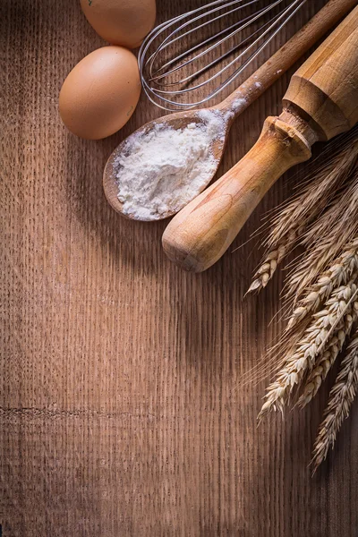 Eggs corolla spoon with flour — Stock Photo, Image