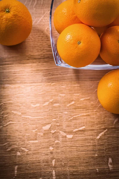 Orange fruits in glass square bowl — Stock Photo, Image