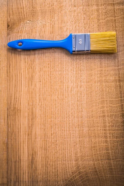 Pincel sobre tabla de madera en blanco — Foto de Stock