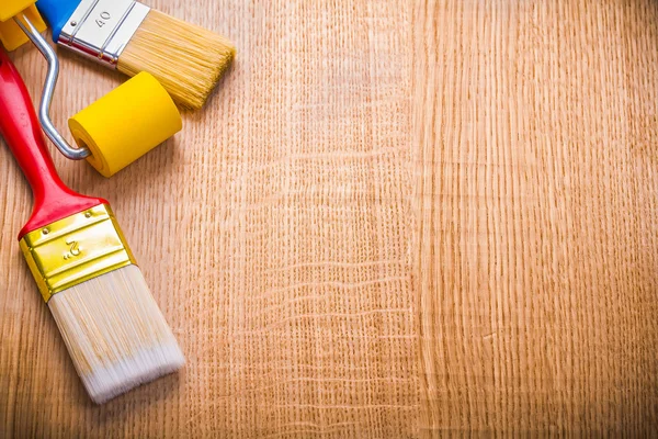 Two paint brushes and roller — Stock Photo, Image