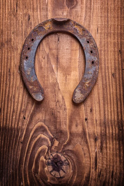 Vintage fából készült táblán egy patkó — Stock Fotó