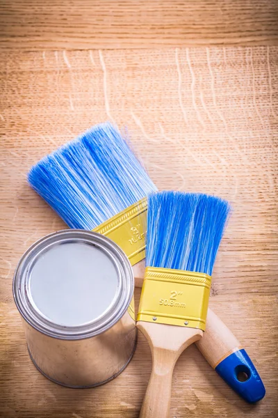 Two paint brushes and can — Stock Photo, Image