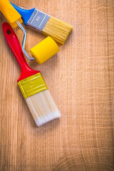 Two paint brushes and roller — Stock Photo, Image