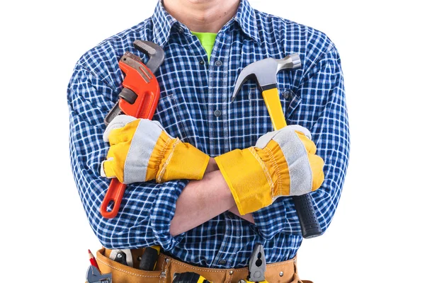 Tools in crossed arms of worker — Stock Photo, Image