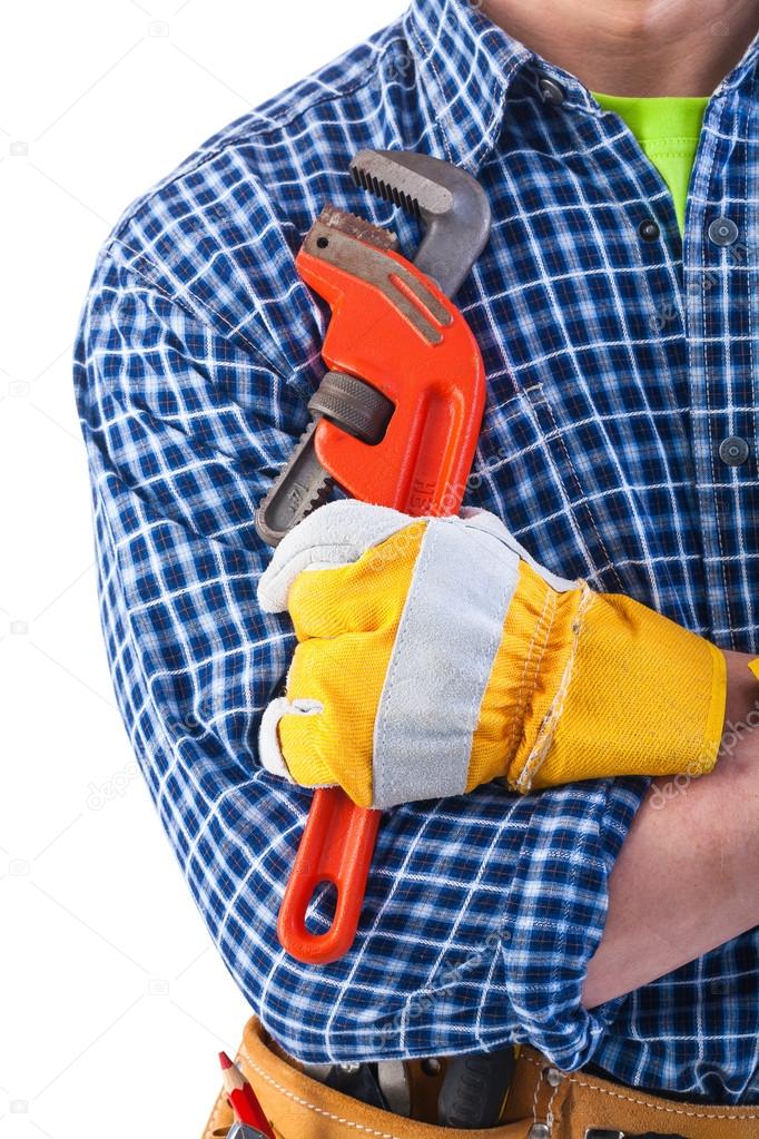 Construction worker holding monkey wrench