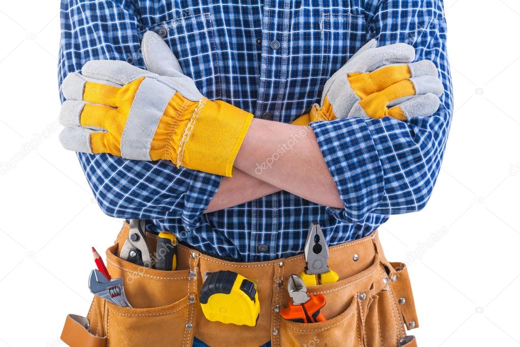 Crossed arms of construction worker