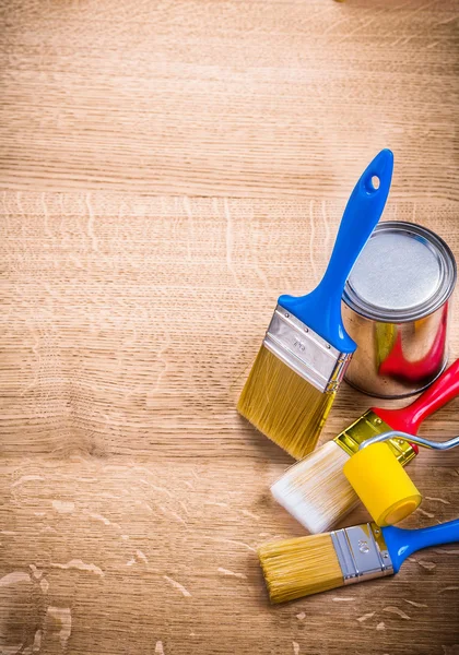 Three paint brushes on wooden board — Stock Photo, Image