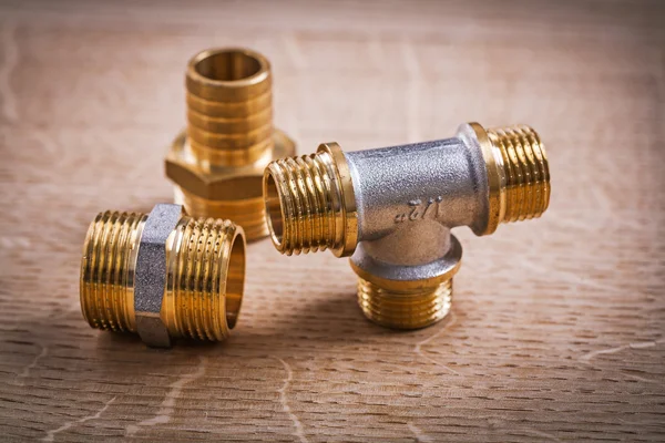 Pipe Connectors On Wooden Board — Stock Photo, Image