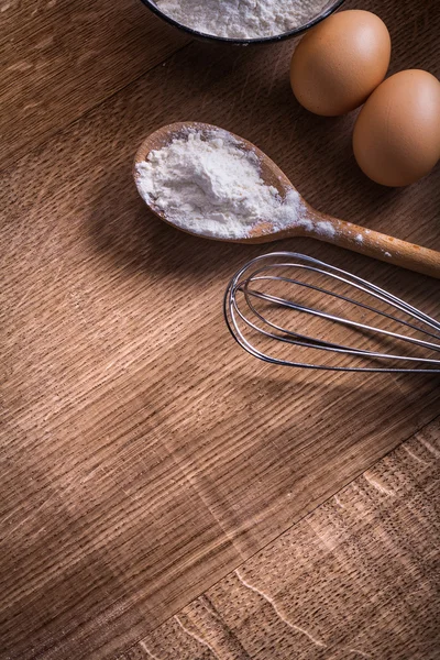 Spoon with flour corolla eggs — Stock Photo, Image