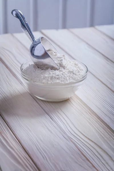 Bowl with flour wooden boards — Stock Photo, Image