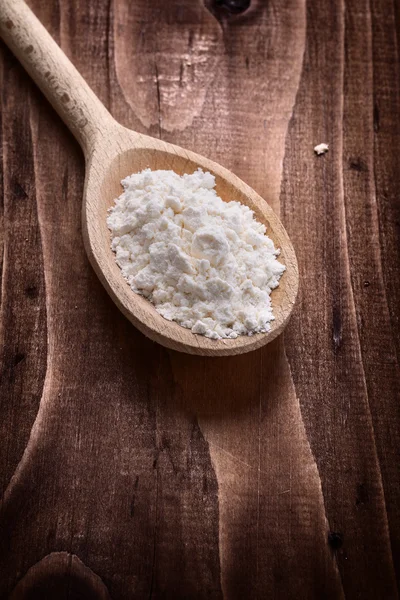 Wooden spoon with flour — Stock Photo, Image