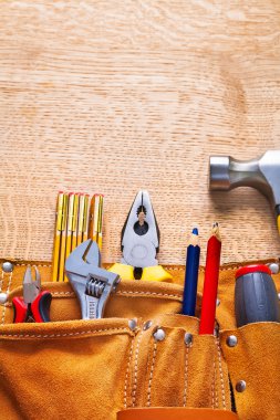 Set of tools in tool belt clipart