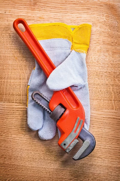 Monkey wrench with protective  glove — Stock Photo, Image
