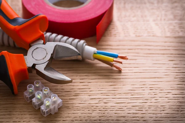 Nippers, insulating tape and terminal blocks — Stock Photo, Image