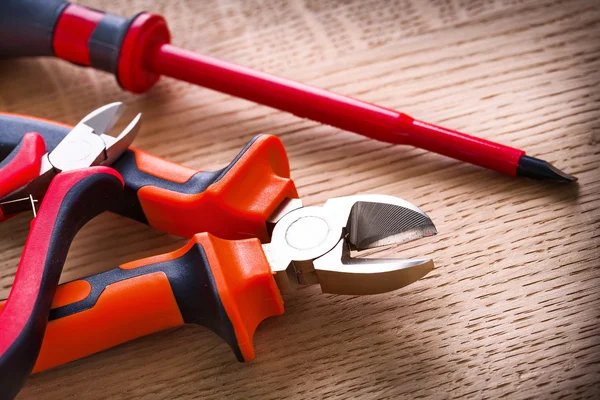 Insulated screwdriver and two nippers — Stock Photo, Image