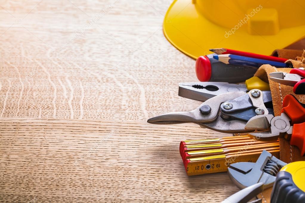Set of working tools on wooden board