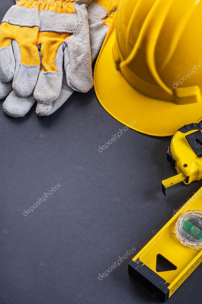 Protective gloves, helmet, level tools Stock Photo by ©mihalec 72700333