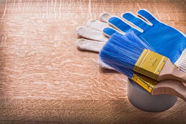 Paint brushes on duct tape and gloves — Stock Photo, Image