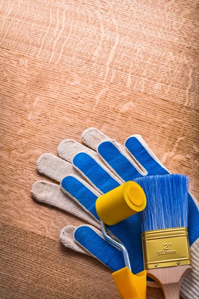 Paint roller brush with protective gloves — Stock Photo, Image