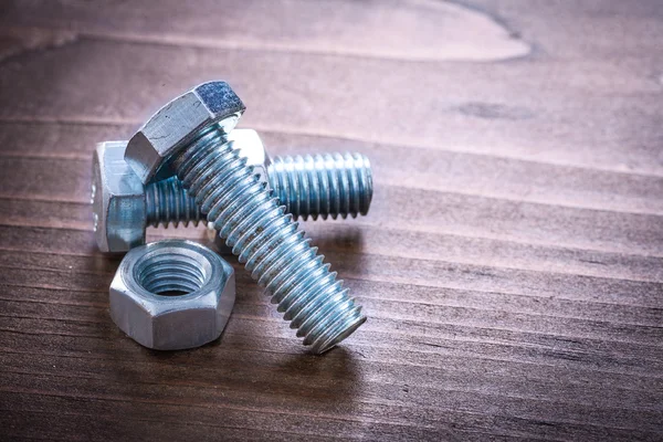 Couple of metal bolts and nuts — Stock Photo, Image