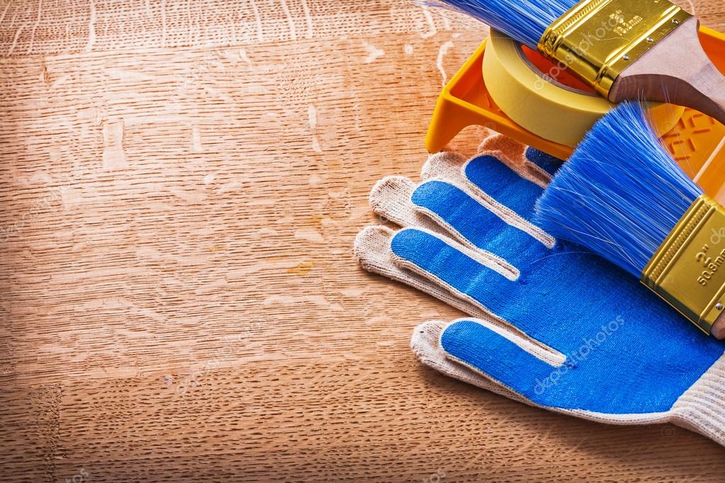 Gloves duct tape paint tray and brushes — Stock Photo © mihalec 72716141