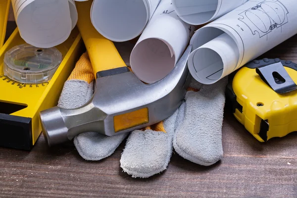 Blueprint rolls and set of construction tools — Stock Photo, Image