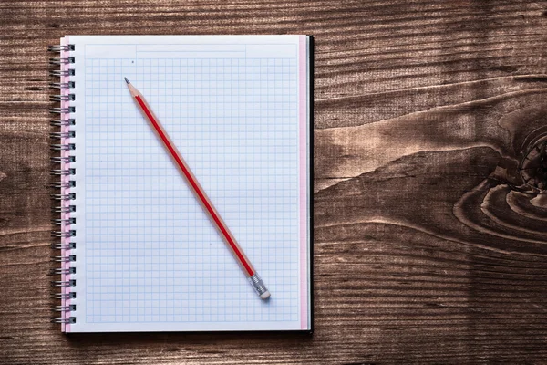 Squared copybook with pencil — Stock Photo, Image