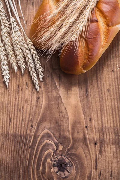 Baguettes and ears of wheat — Stock Photo, Image