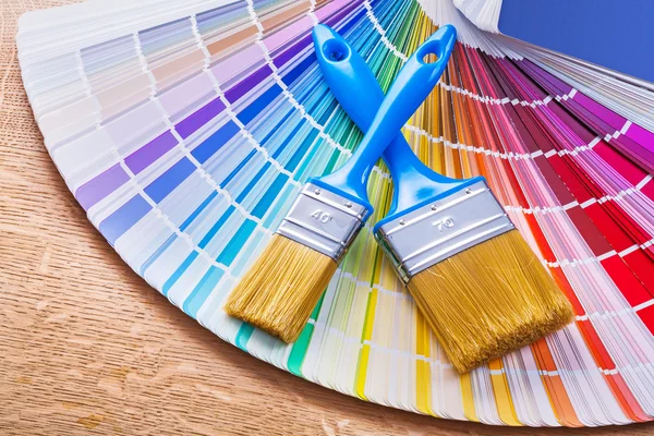 Paint brushes  on color palette Stock Photo
