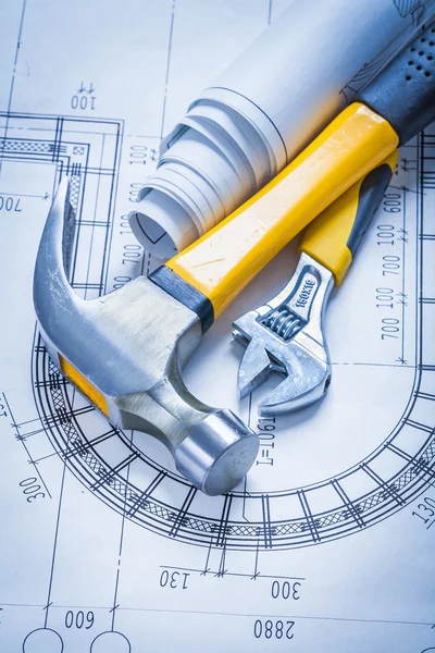 Claw hammer, blueprints, adjustable spanner — Stock Photo, Image