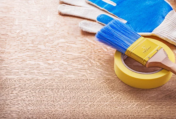 Household tape, paint brush, gloves — Stock Photo, Image