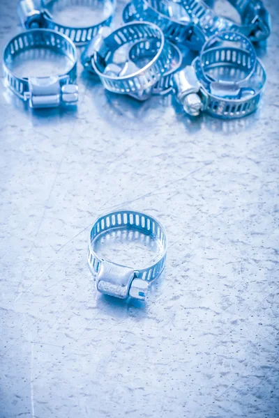 Composition of stainless saddle clamps — Stock fotografie