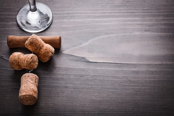 Corks of champagne with corkscrew  and glass — Stok fotoğraf