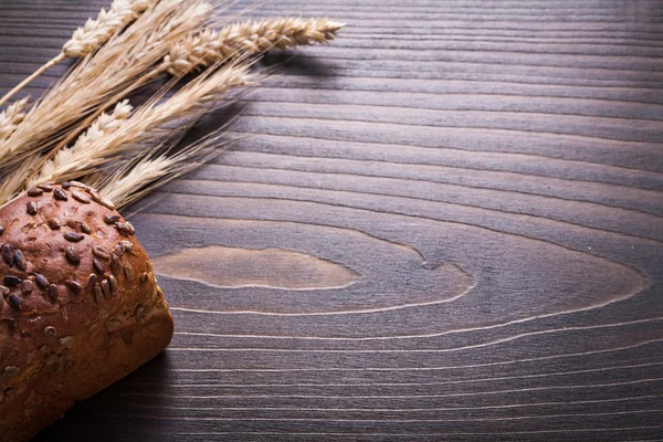 Golden wheat rye ears with loaf of bread — Stock Photo, Image