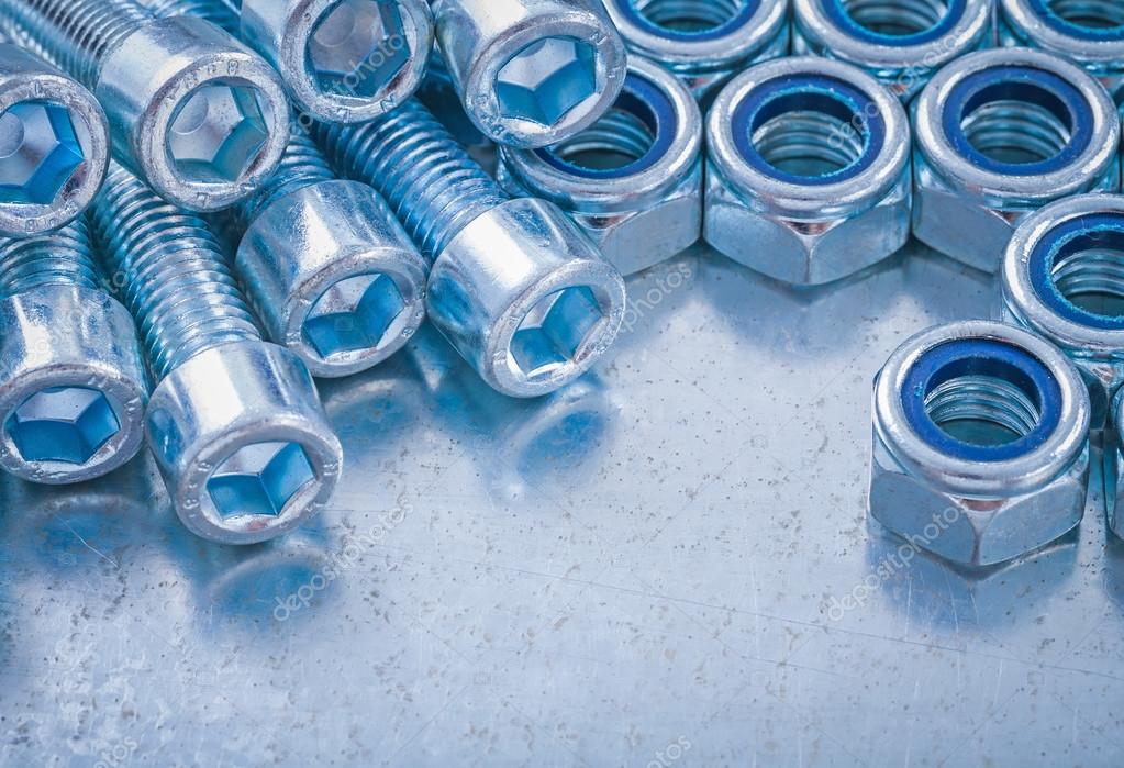 Threaded stainless screw bolts and nuts Stock Photo by ©mihalec 76140633