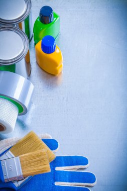 Paint cans, bottles, brushes