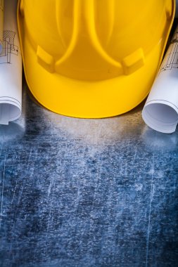 Pair of construction plans and hard hat