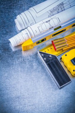 construction level, wooden meter, blueprints