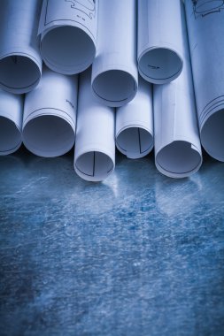 Pile of rolled engineering drawings