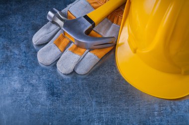 protective gloves, hard hat and hammer