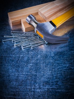 construction nails, hammer and wooden bricks