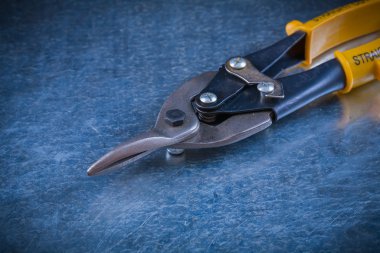 Tin snips, construction concept
