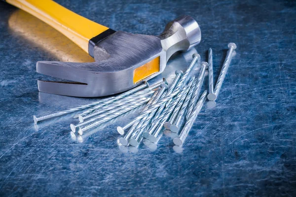 Construction nails with claw hammer — Stock Photo, Image